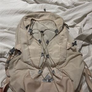 The North Face Cream Backpack with Utility Design
